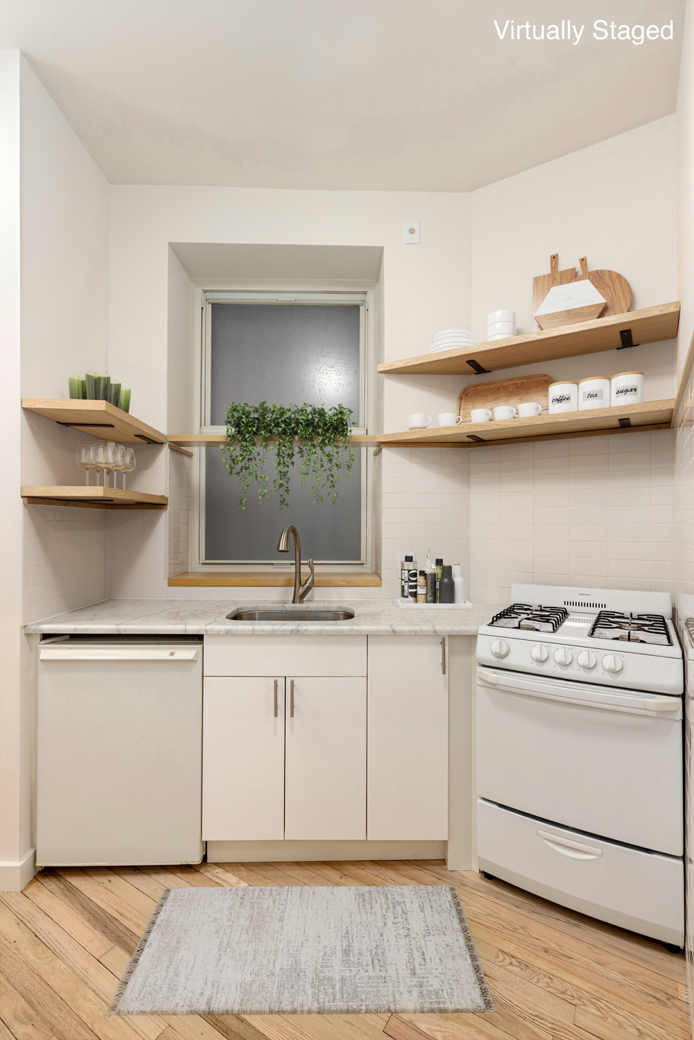 518 East 11th Street, Unit 1B Manhattan, NY 10009 - Photo 6 of 9 a kitchen with a stove and cabinets