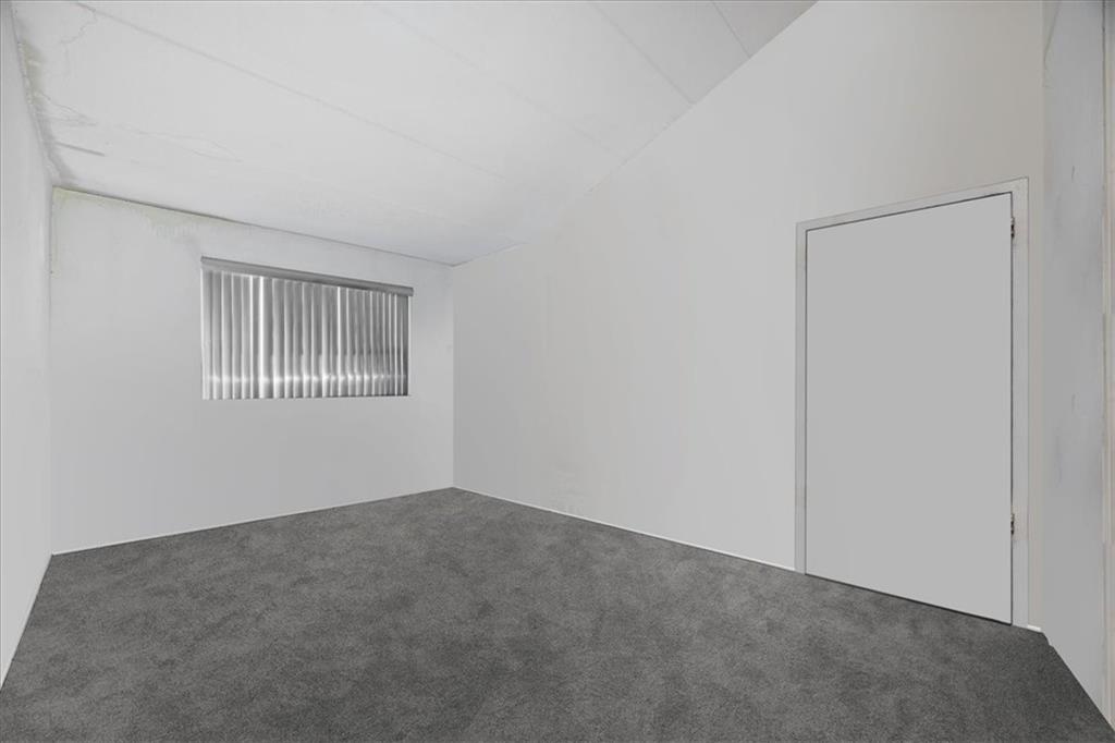 1431 East 108th Street, Unit 10E Brooklyn, NY 11236 - Photo 6 of 10 a view of an empty room with windows