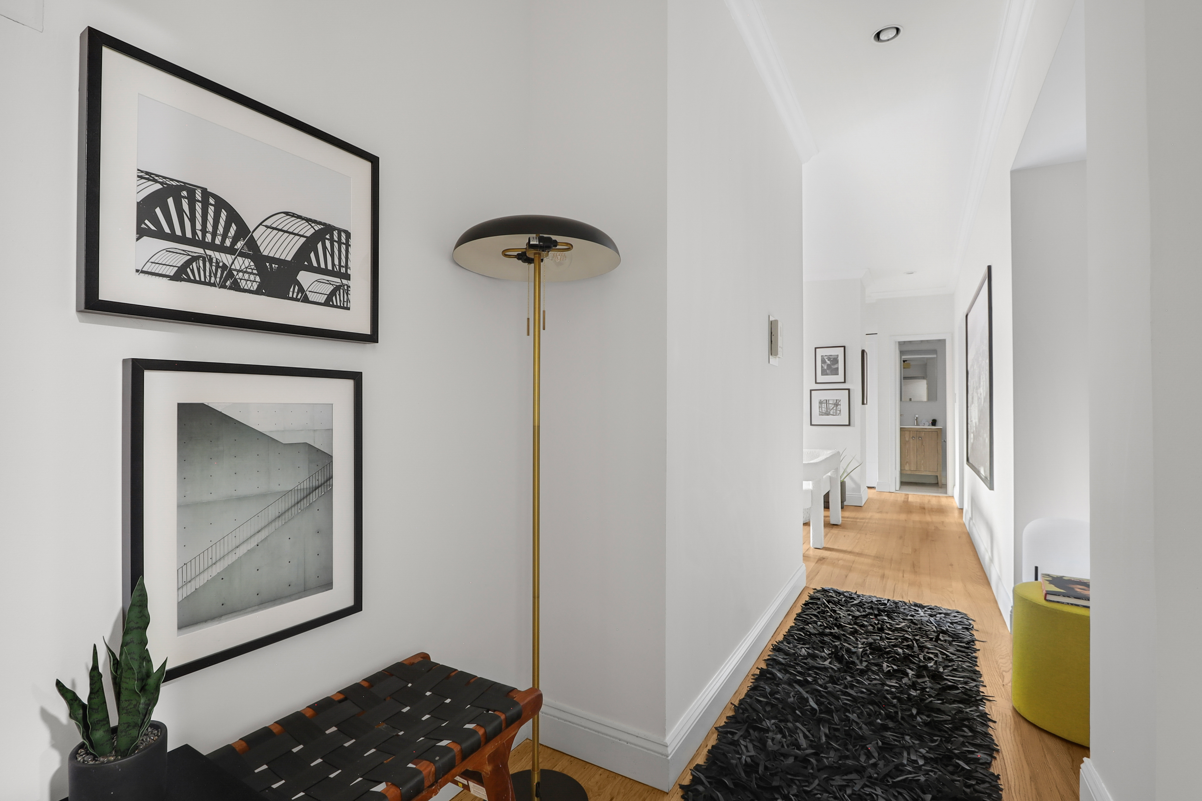 250 West 103rd Street, Unit 4A Manhattan, NY 10025 - Photo 6 of 14 a view of a hallway with wooden floor and a dining table