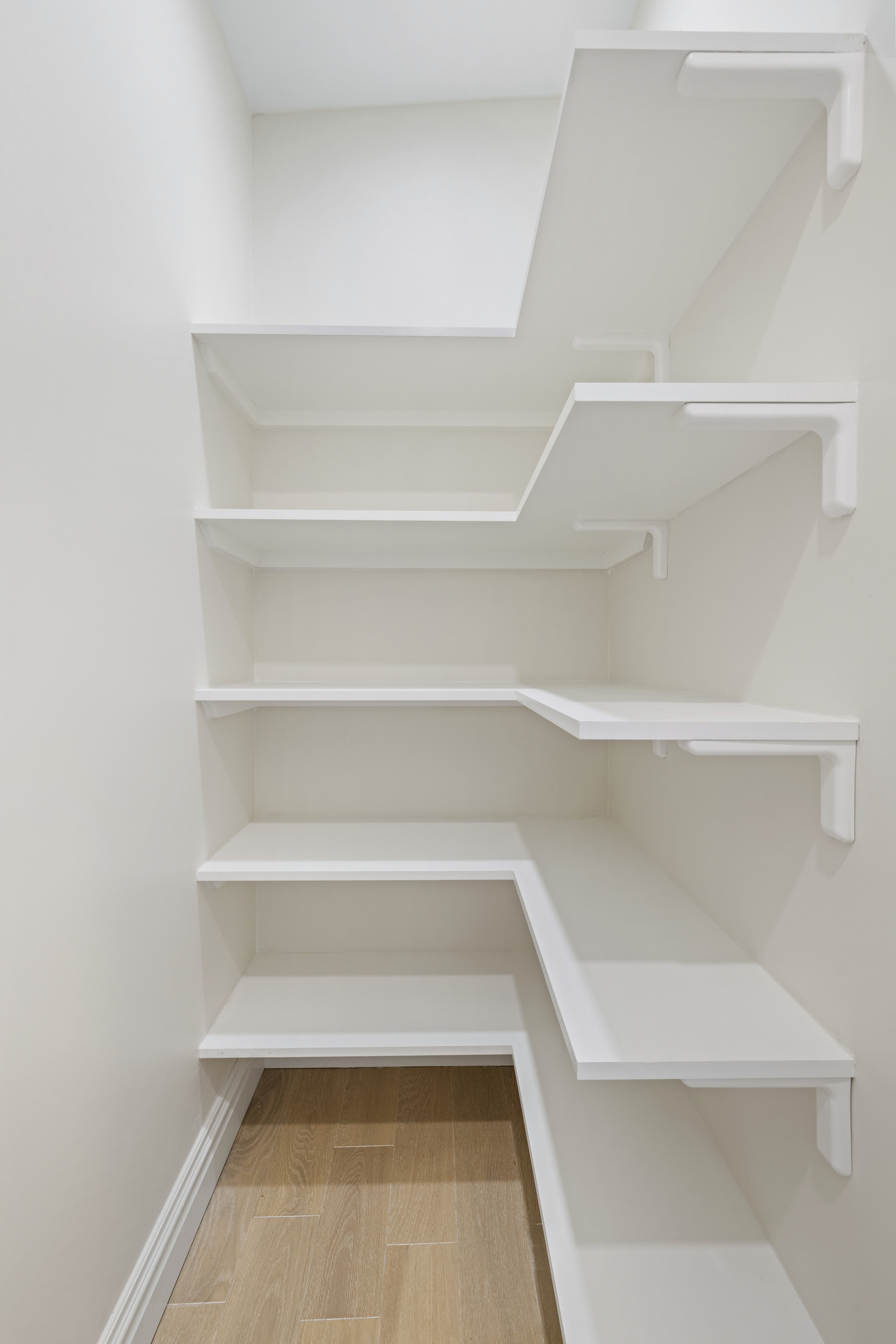 178 Sullivan Street, Unit 2A Manhattan, NY 10012 - Photo 9 of 19 a view of a room with shelf