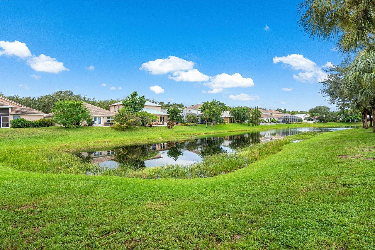 1182 Canoe Point Delray Beach, FL 33444 - Photo 42 of 46 a view of a golf course with a lake