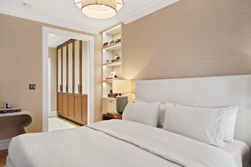 67 Perry Street, Unit 3 Manhattan, NY 10014 - Photo 15 of 22 a bedroom with a bed and a chandelier