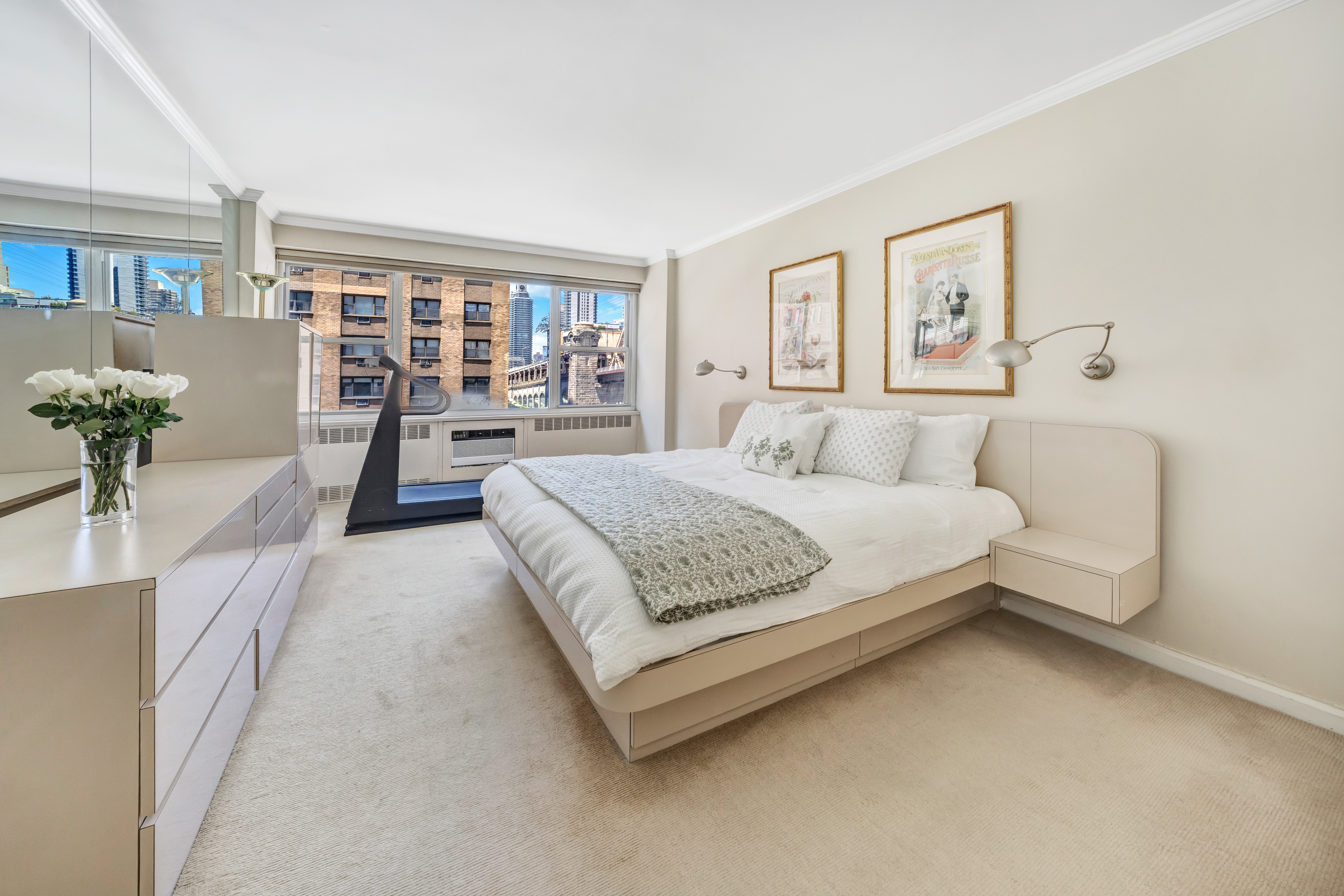 35 Sutton Place, Unit 7E Manhattan, NY 10022 - Photo 9 of 18 a bedroom with a large bed and a painting on the wall