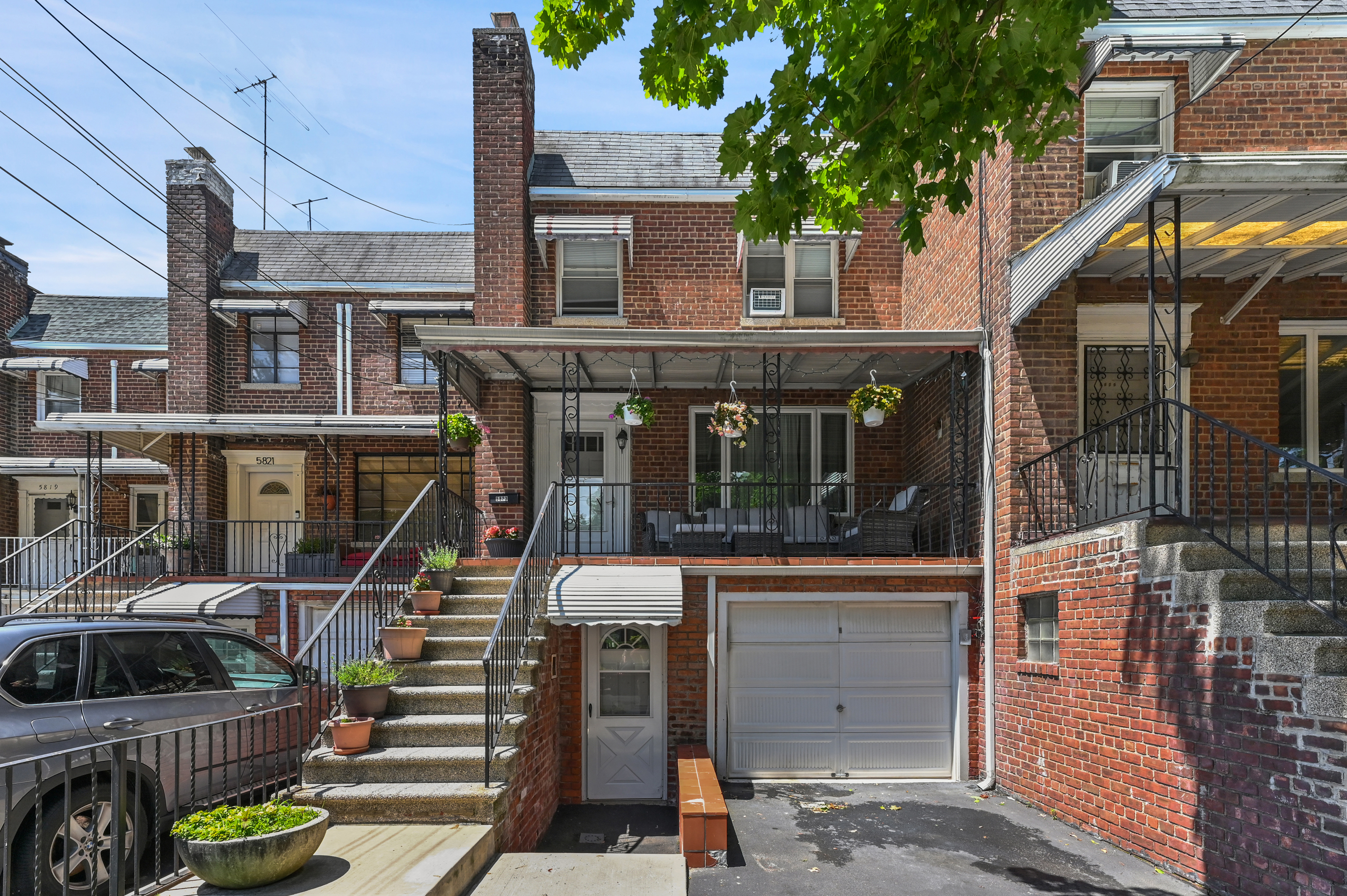 5823 Fieldston Road, Unit 1A Bronx, NY 10471 - Photo 25 of 26 a view of a house with wooden floor and a potted plant