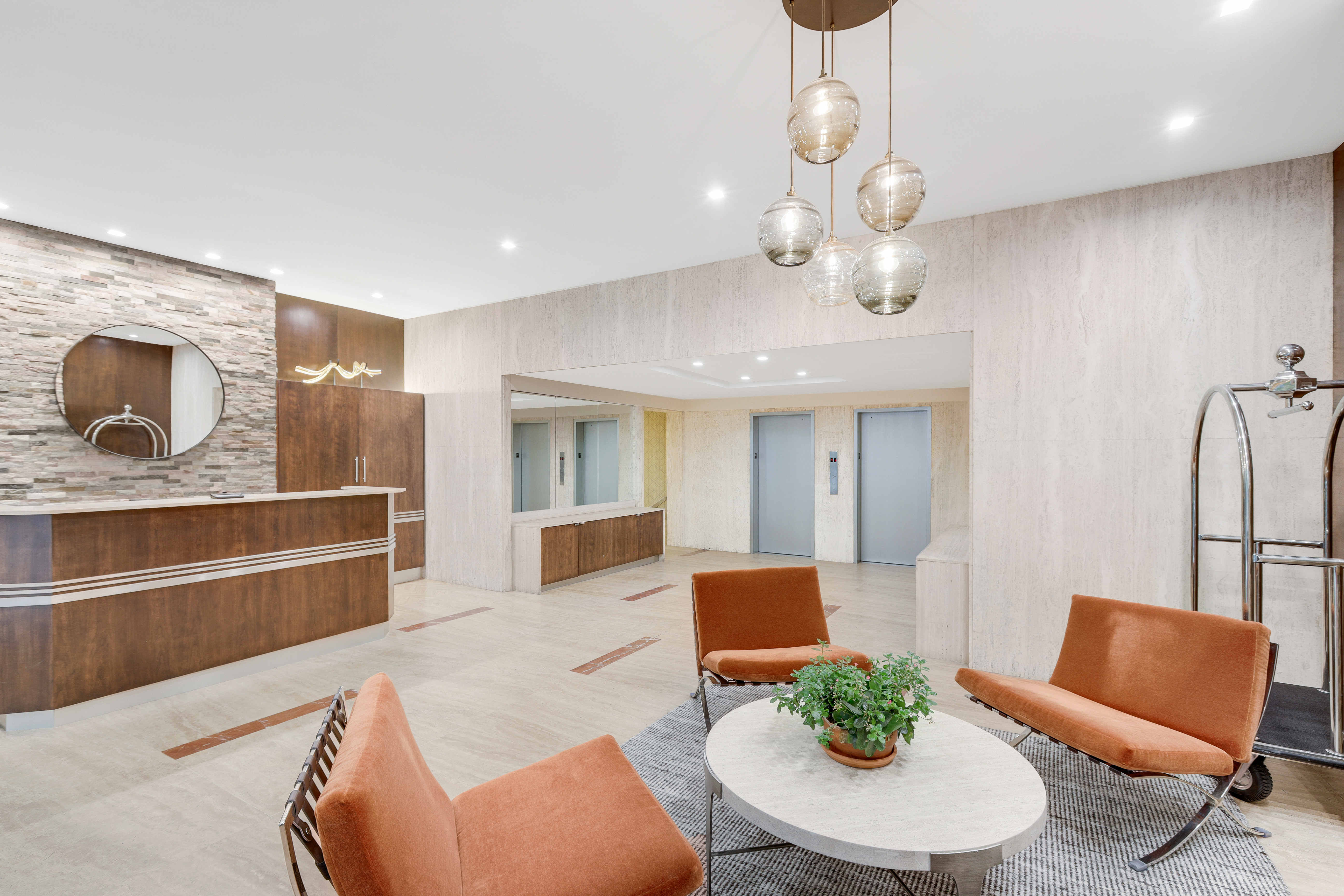 330 East 49th Street, Unit 9A Manhattan, NY 10017 - Photo 5 of 7 a large living room with stainless steel appliances kitchen island granite countertop furniture and a fireplace