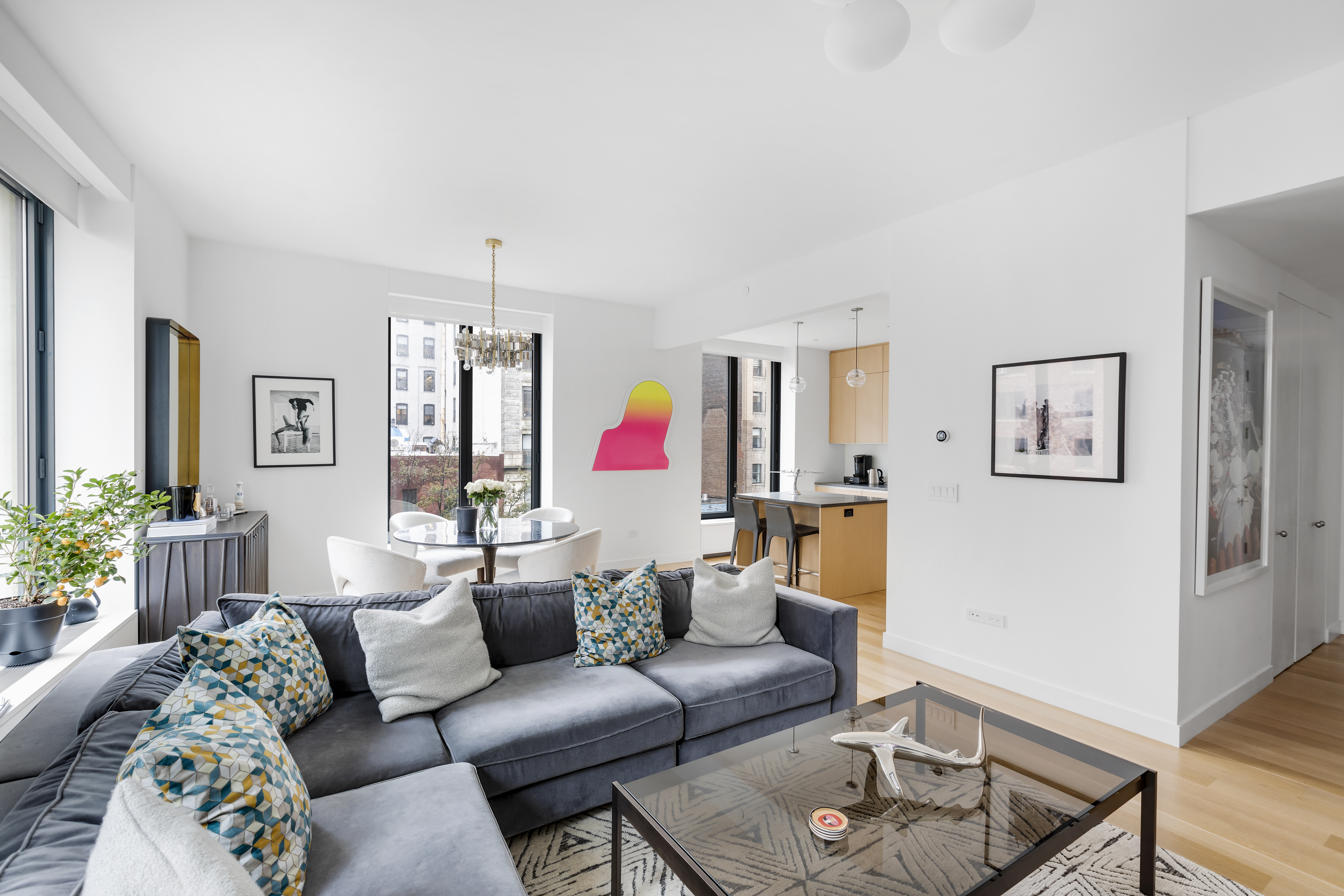 21 East 12th Street, Unit 5B Manhattan, NY 10003 - Photo 2 of 11 a living room with furniture and wooden floor