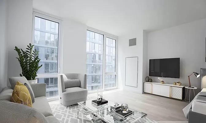 540 West 49th Street, Unit 407N Manhattan, NY 10019 - Photo 7 of 12 a living room with furniture and a flat screen tv