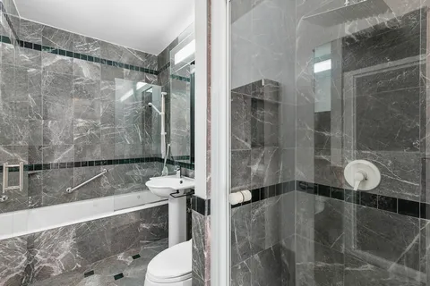 a bathroom with a sink and toilet