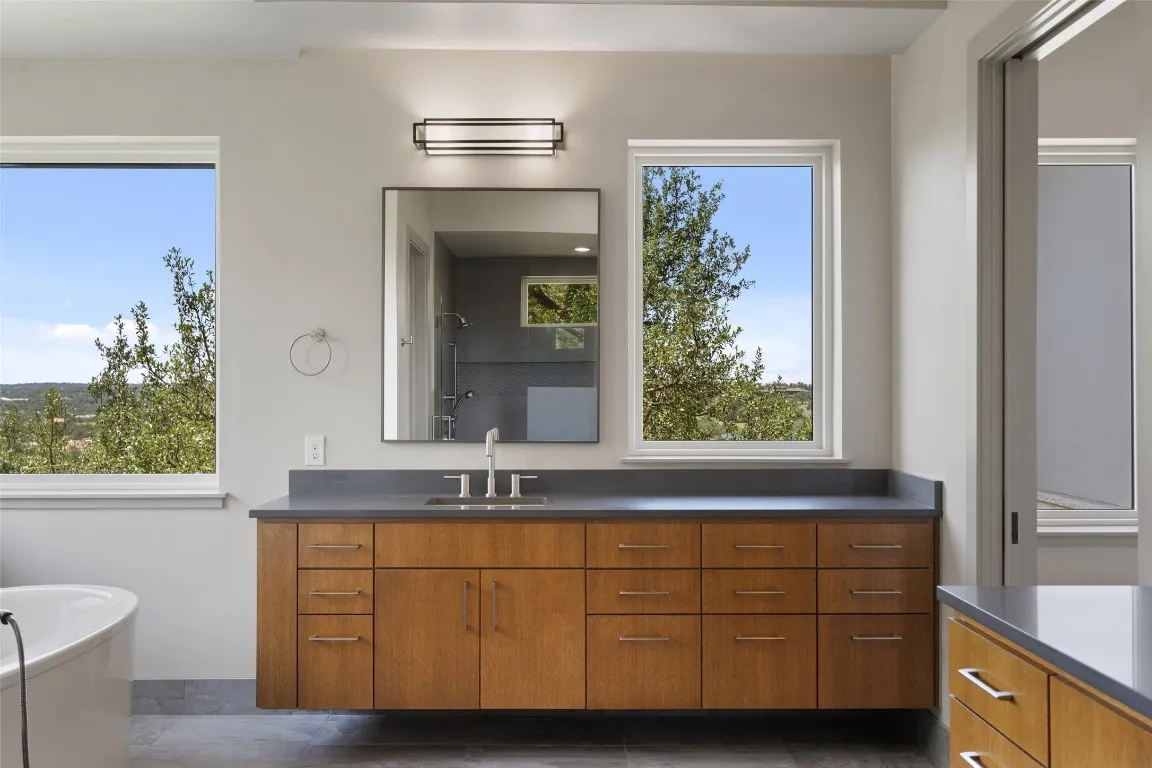 a bathroom with a sink and a mirror