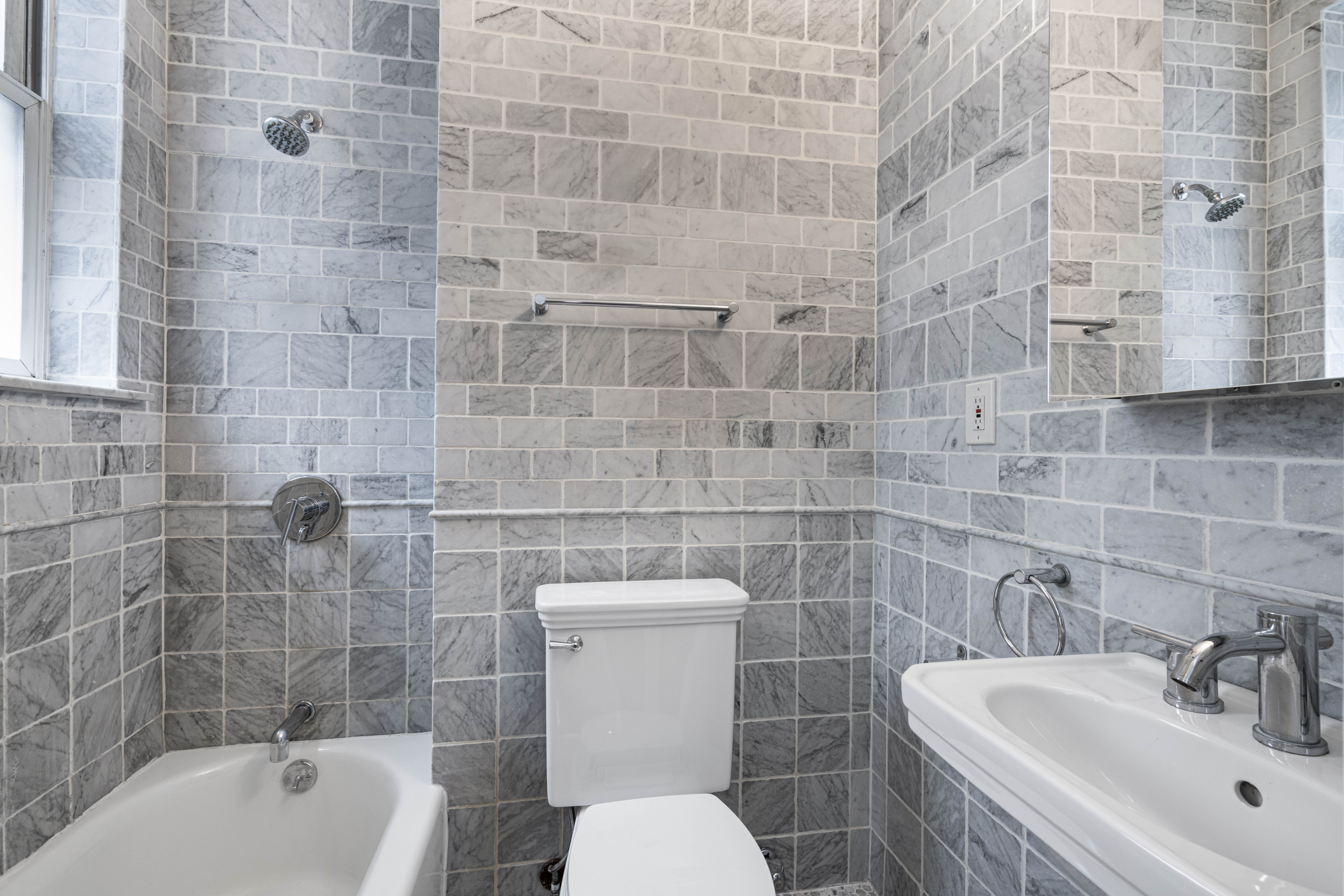 380 Riverside Drive, Unit 7B Manhattan, NY 10025 - Photo 7 of 12 a bathroom with a sink a toilet and bathtub