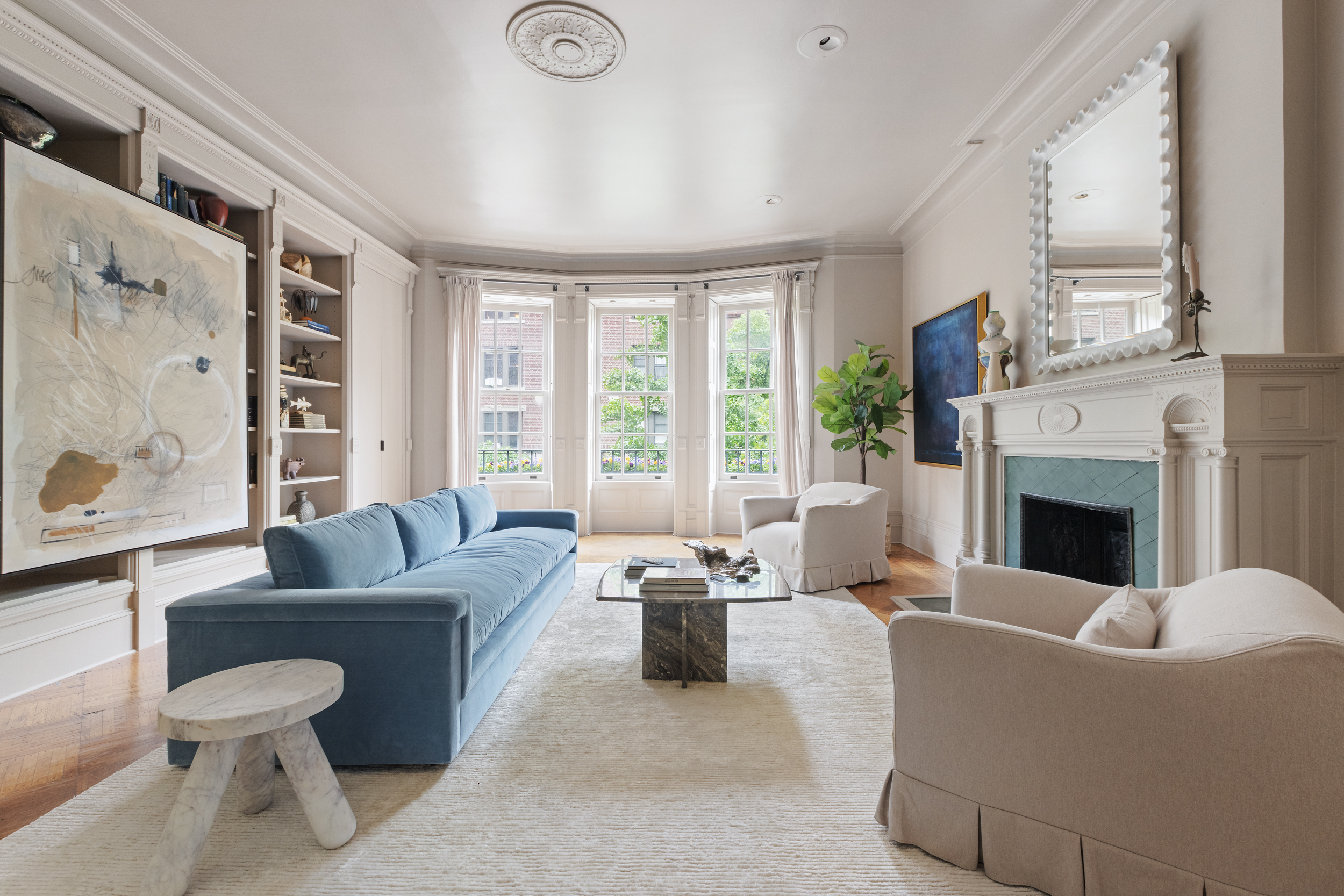 37 West 70th Street Manhattan, NY 10023 - Photo 24 of 41 a living room with furniture a large window and a fireplace