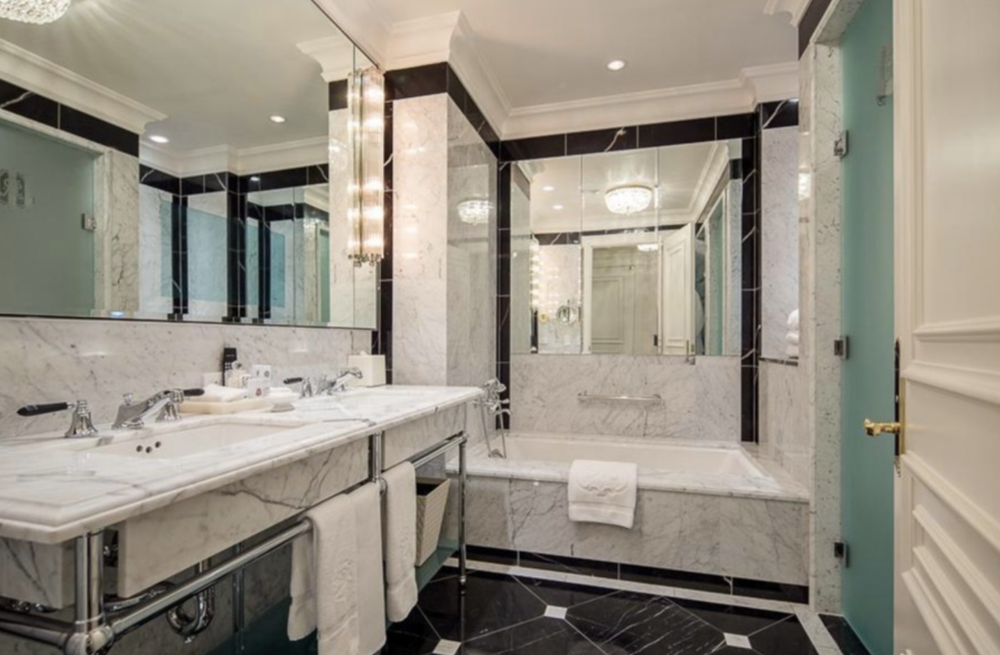 2 East 55th Street, Unit 1018W35 Manhattan, NY 10022 - Photo 5 of 11 a bathroom with a granite countertop sink mirror and a bathtub