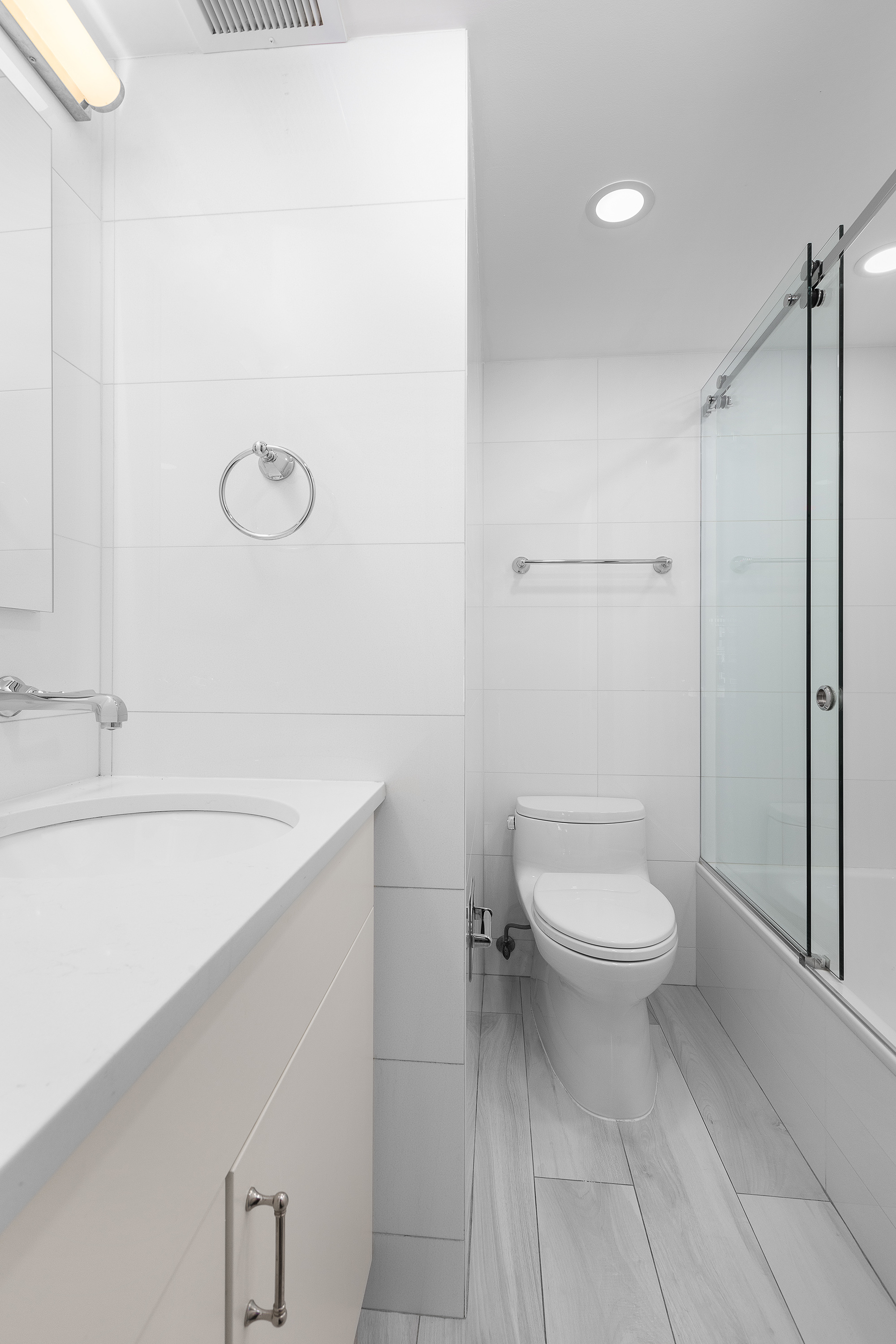 1088 Park Avenue, Unit 15C Manhattan, NY 10128 - Photo 13 of 26 a bathroom with a toilet a sink and shower