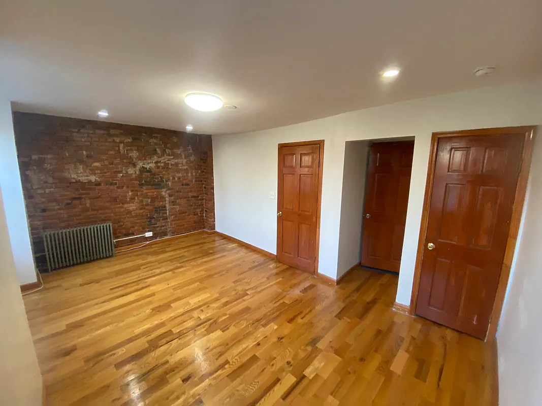 62 Bainbridge Street, Unit 4 Brooklyn, NY 11233 - Photo 5 of 8 a view of livingroom with wooden floor