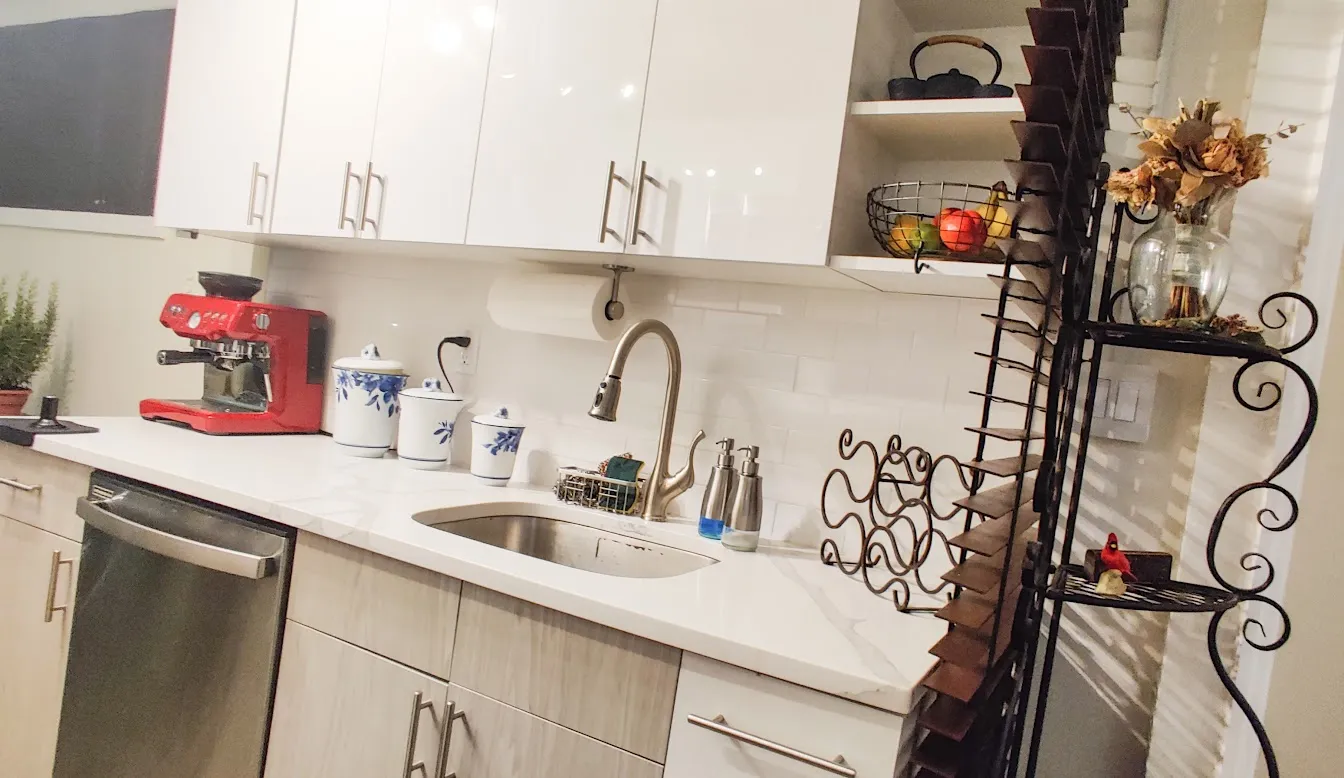 a living room with a bed and a dresser