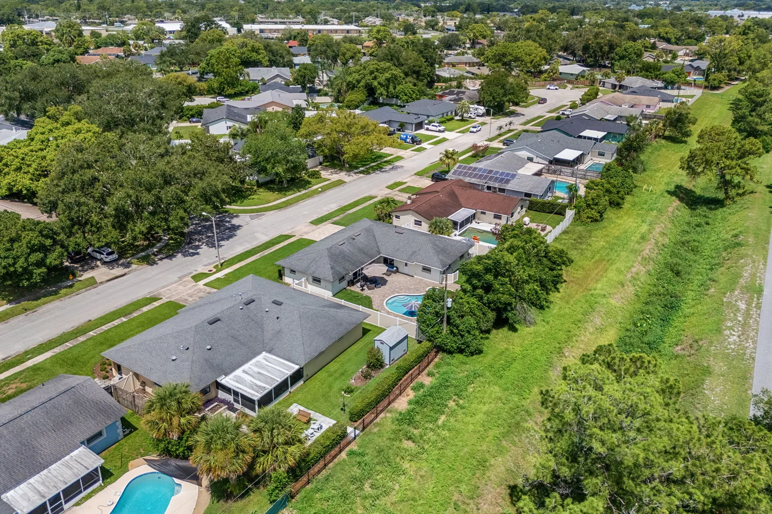 an aerial view of residential houses with outdoor space
