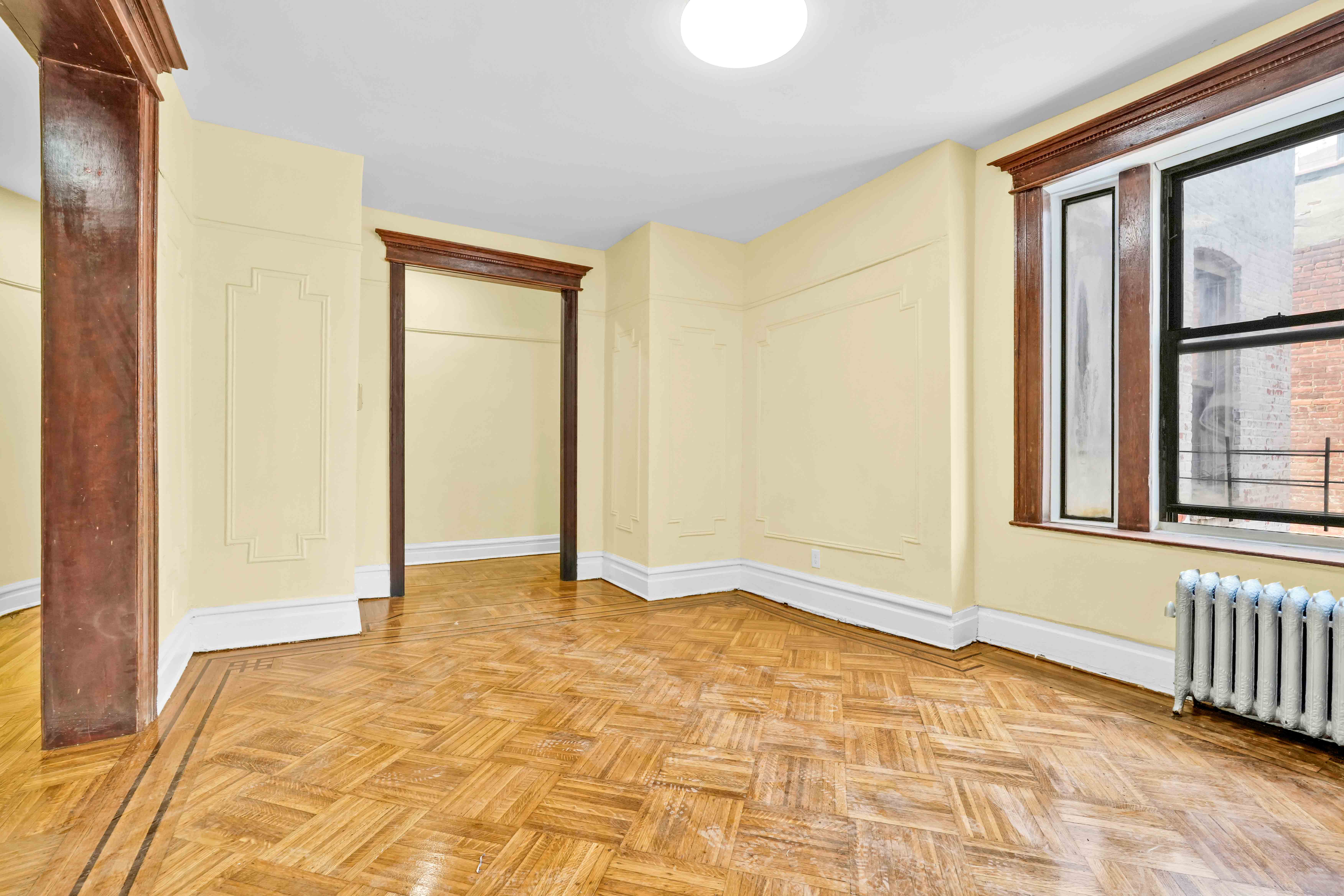 1770 Bedford Avenue Brooklyn, NY 11225 - Photo 11 of 50 a view of an empty room with window and bathroom