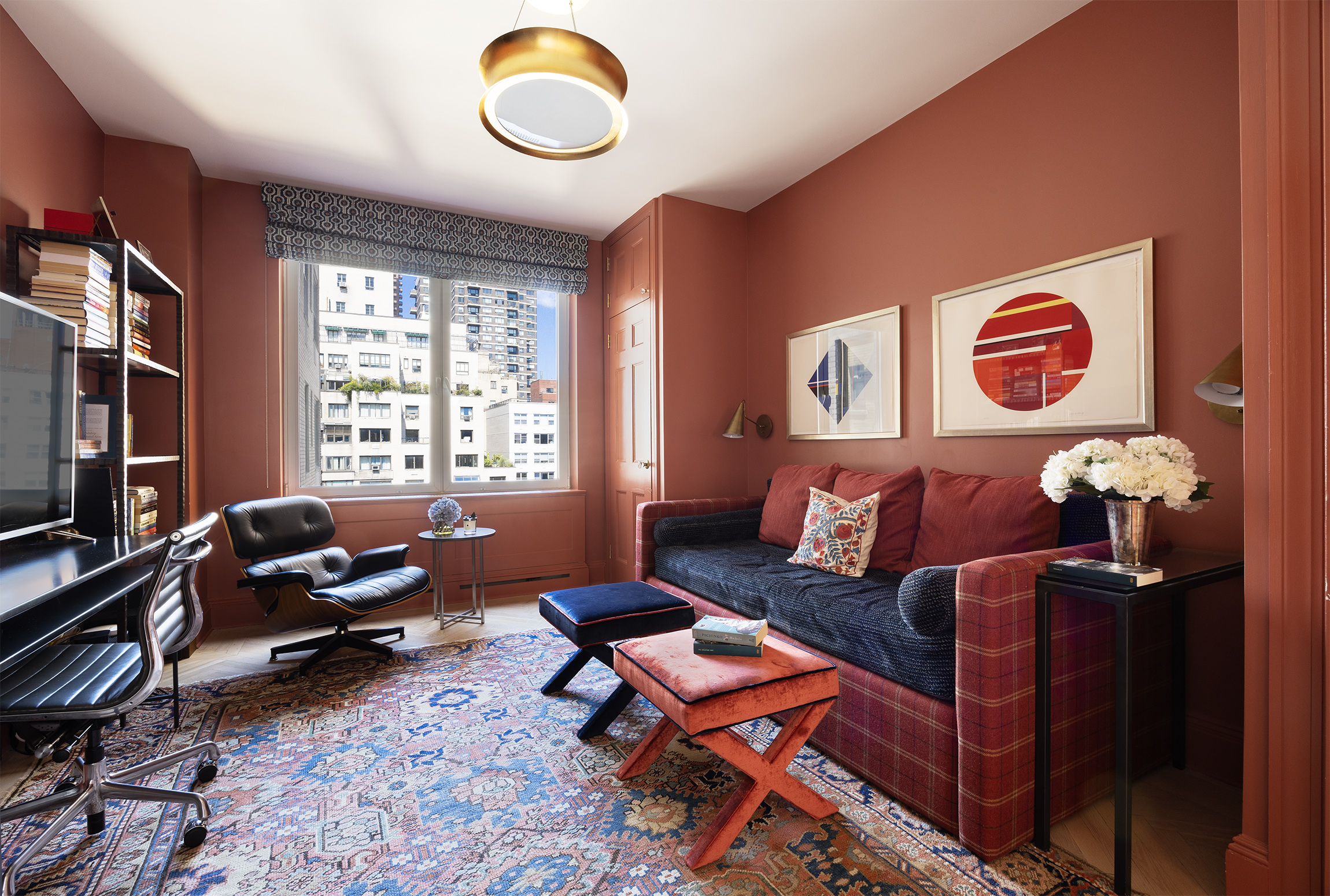 49 East 86th Street, Unit 11A Manhattan, NY 10028 - Photo 8 of 10 a living room with furniture and a flat screen tv