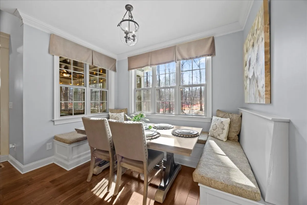a bathroom with a granite countertop sink a large mirror and a shower