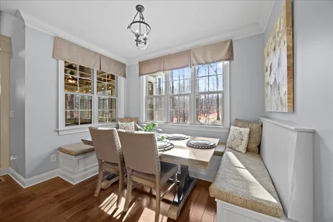 a bathroom with a granite countertop sink a large mirror and a shower