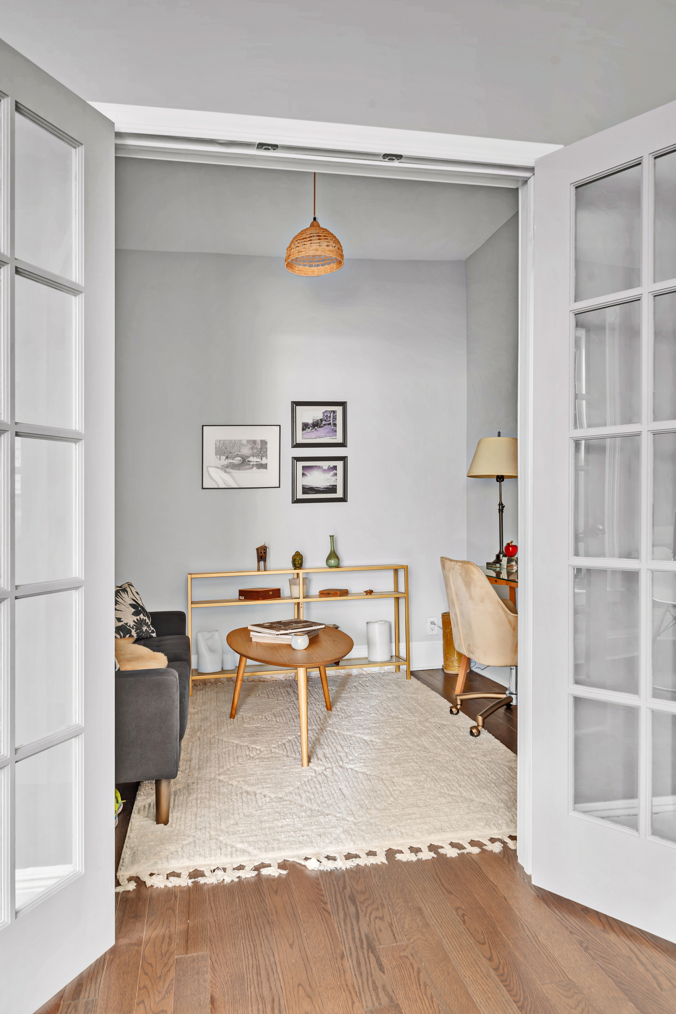 72 East 93rd Street, Unit 5 Manhattan, NY 10128 - Photo 5 of 17 a living room with furniture and a book shelf