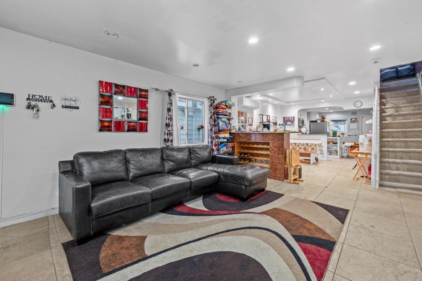 1419 East 54th Street Brooklyn, NY 11234 - Photo 5 of 19 a living room with furniture and a view of kitchen
