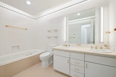 a kitchen with cabinets a sink and appliances