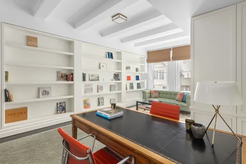 a view of a workspace with furniture