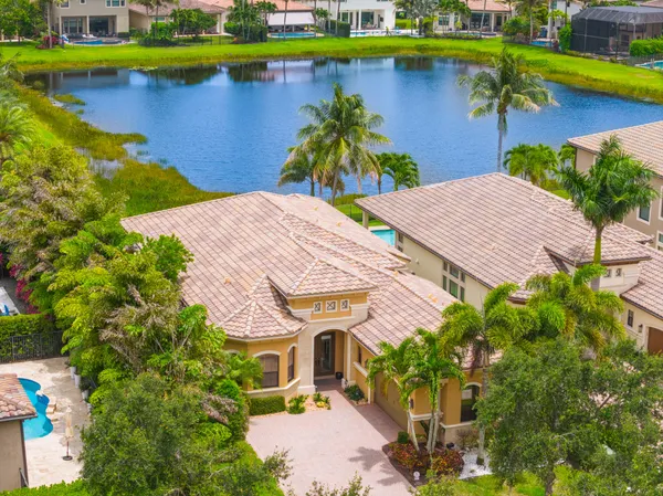 an aerial view of a house with a lake view