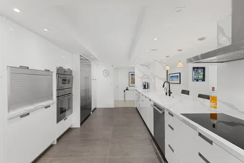 a bathroom with a shower sink and mirror