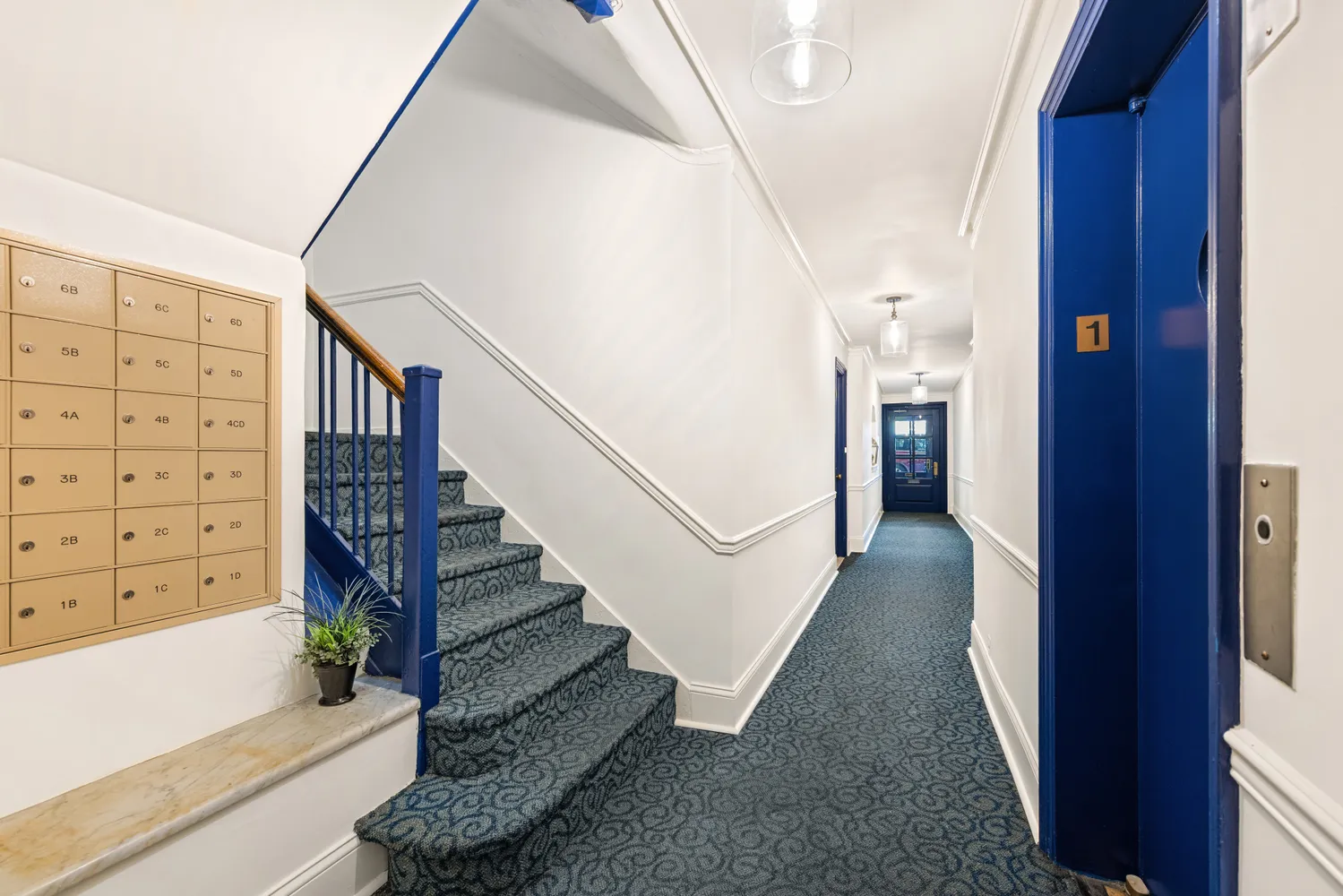 a view of staircase with white walls and a window
