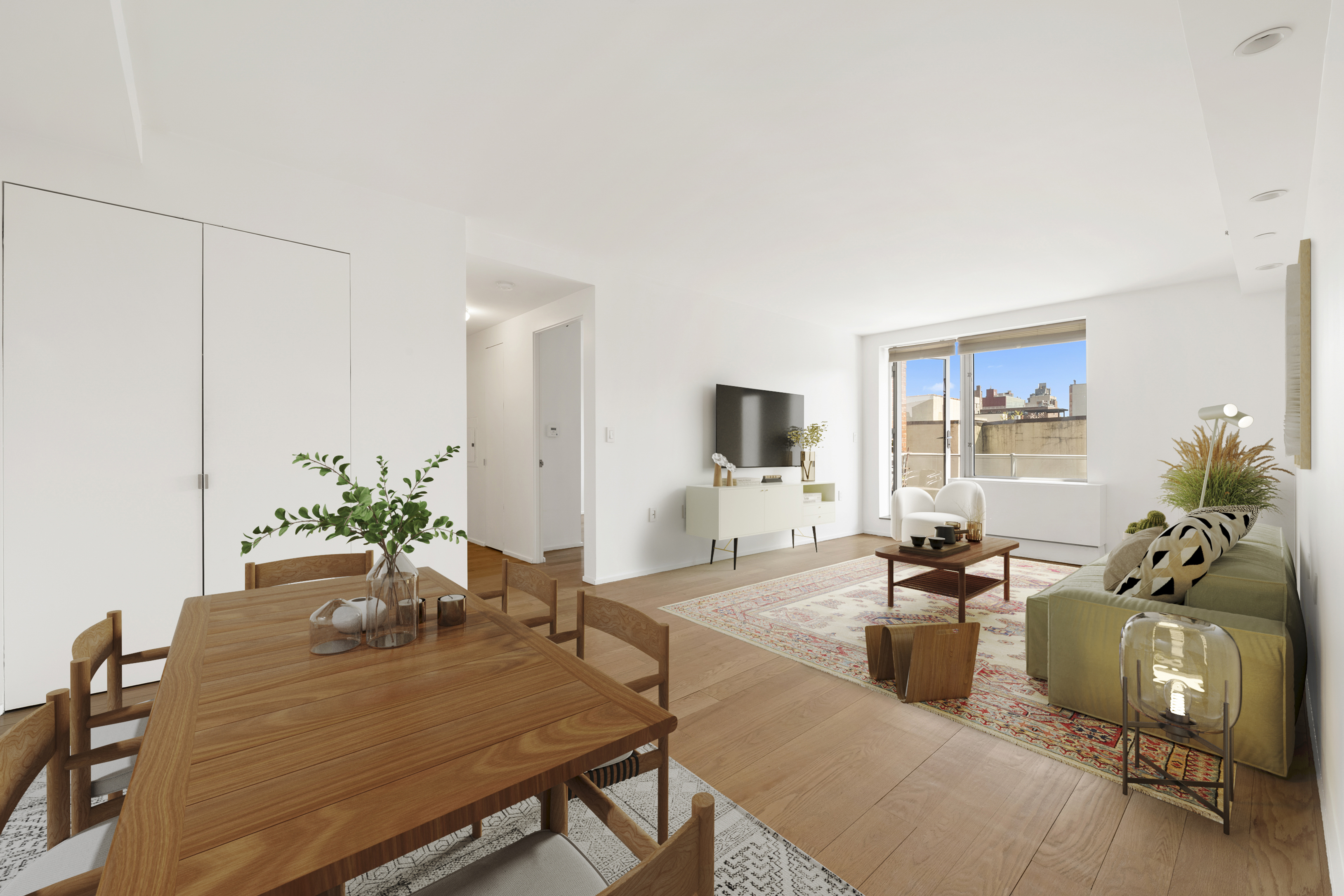 2280 Frederick Douglass Boulevard, Unit 6A Manhattan, NY 10027 - Photo 3 of 13 a living room with furniture and a flat screen tv