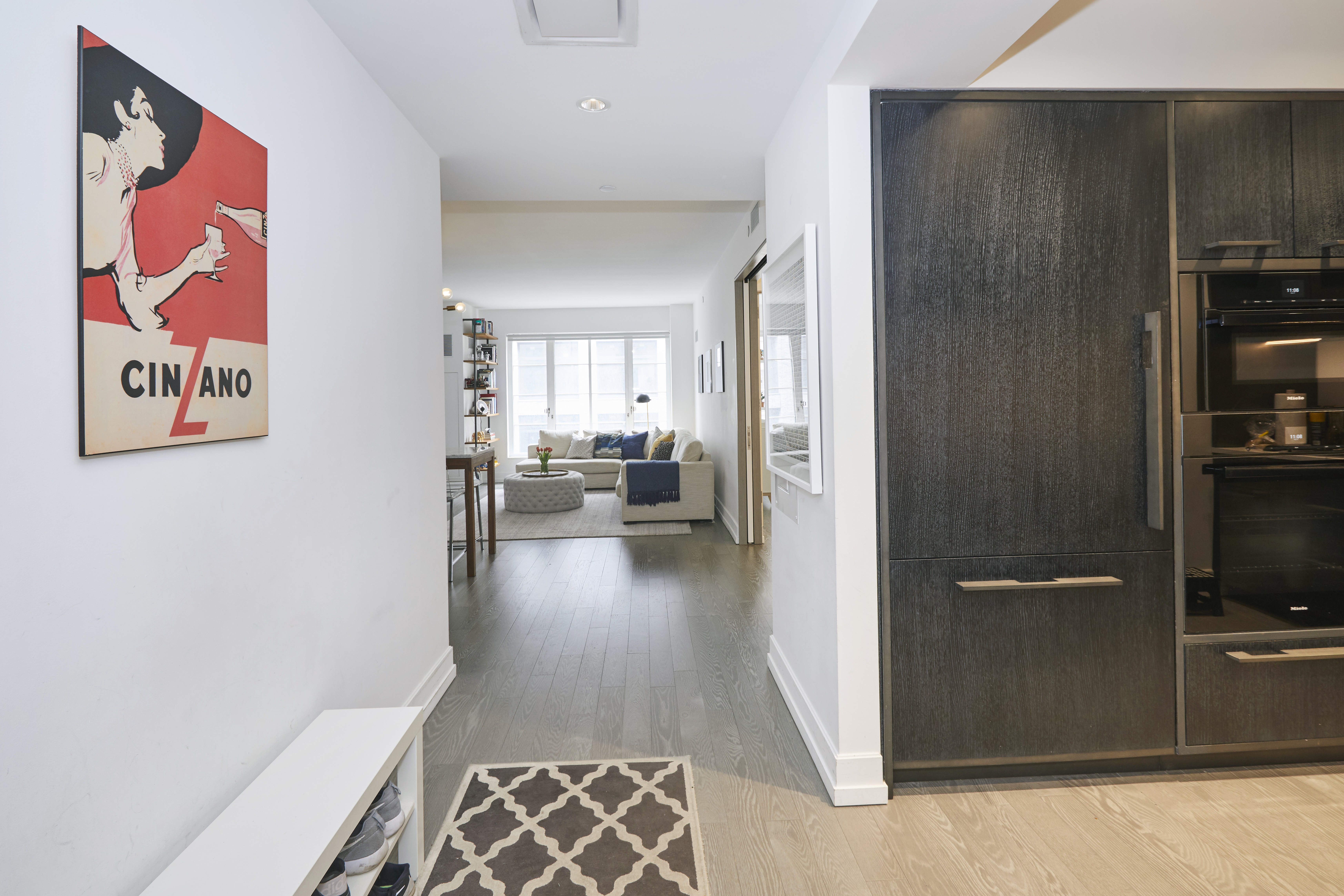 70 Charlton Street, Unit 7E Manhattan, NY 10014 - Photo 5 of 17 a view of a hallway with bathroom and wooden floor