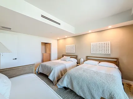 a bathroom with a granite countertop sink mirror and shower