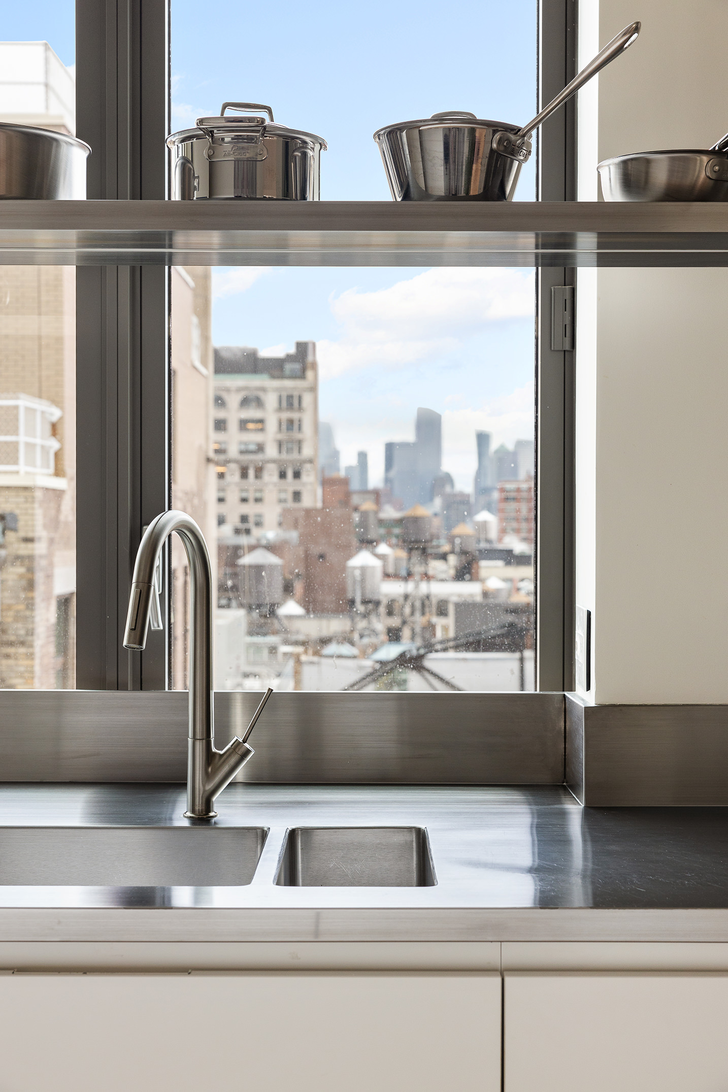 4 West 21st Street, Unit PH Manhattan, NY 10010 - Photo 8 of 14 a view of a kitchen counter top a stove and a sink