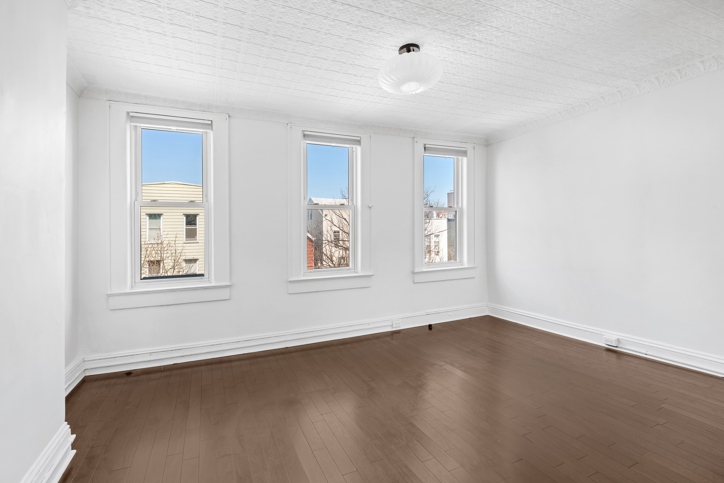 404 A 17th Street, Unit 3 Brooklyn, NY 11215 - Photo 4 of 9 a view of an empty room with a window