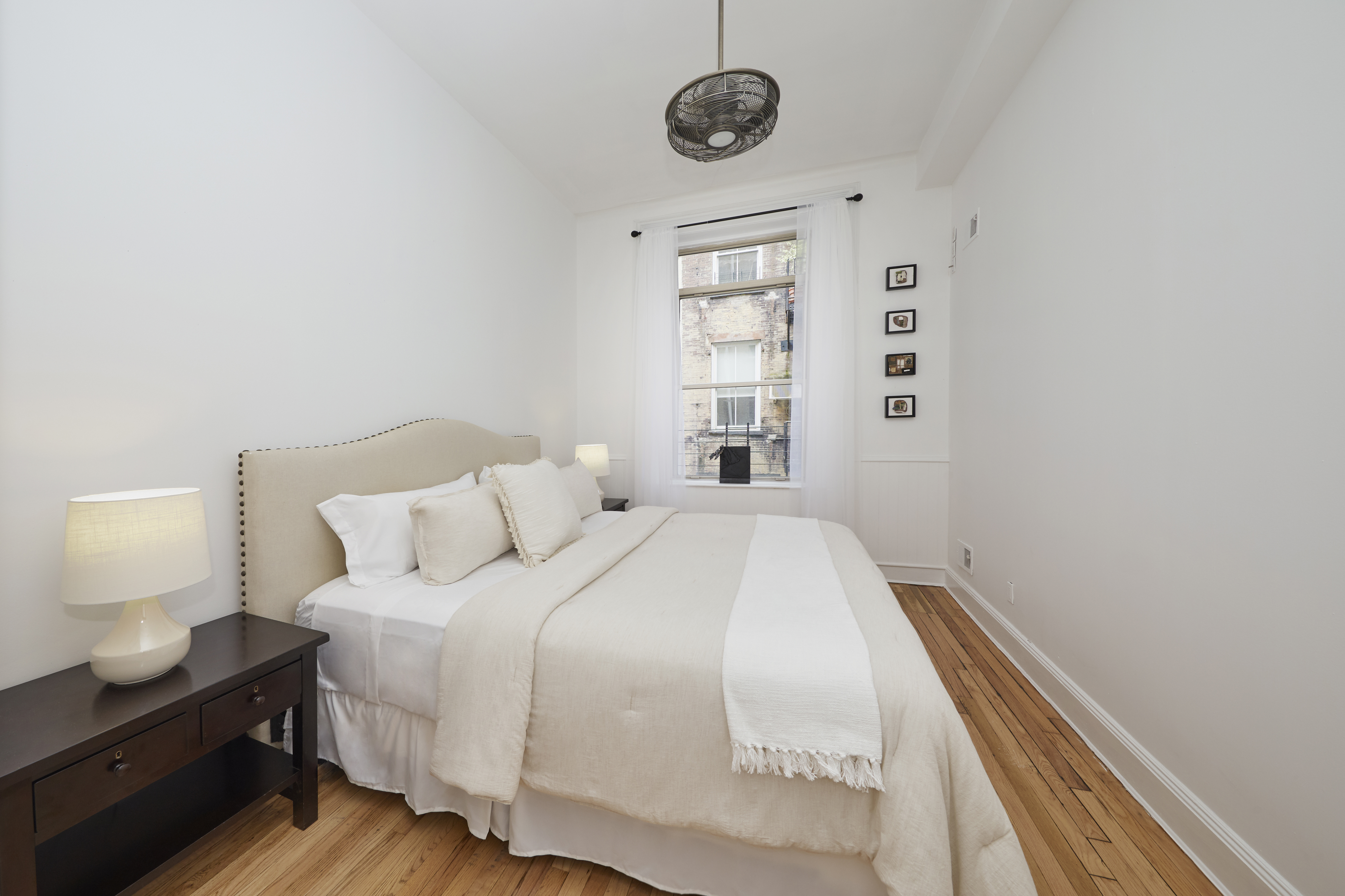 80 Leonard Street, Unit 3G Manhattan, NY 10013 - Photo 17 of 30 a spacious bedroom with a bed and a window