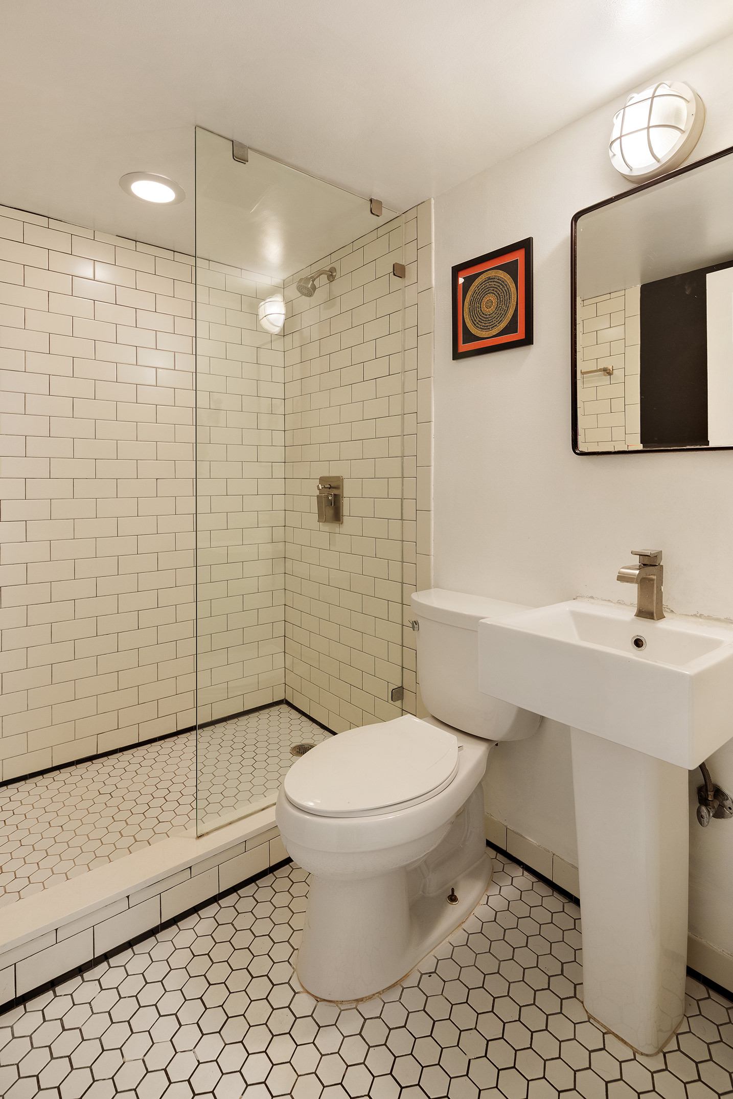 123 Cambridge Place Brooklyn, NY 11238 - Photo 16 of 22 a bathroom with a sink toilet and shower