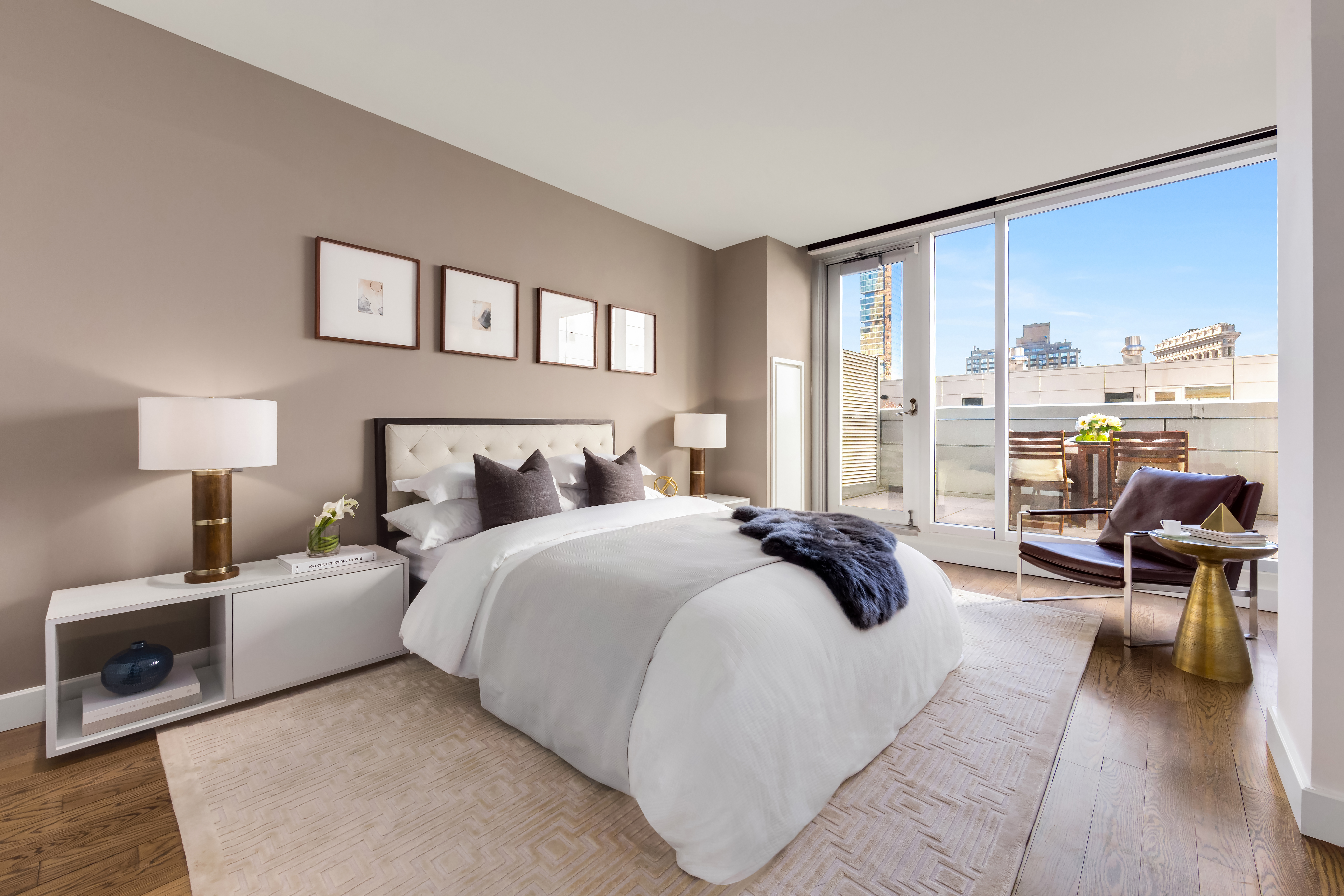 225 5th Avenue, Unit PHY Manhattan, NY 10010 - Photo 3 of 10 a bedroom with a bed and glass walk in closet