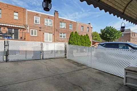 a view of a brick house with many windows