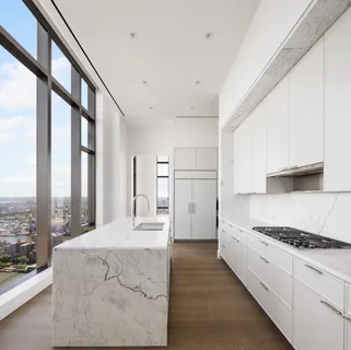 a view of a kitchen with a sink and dishwasher