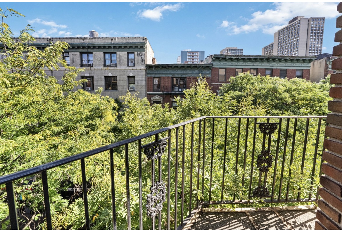 211 Thompson Street, Unit 5L Manhattan, NY 10012 - Photo 5 of 7 a city view from a balcony