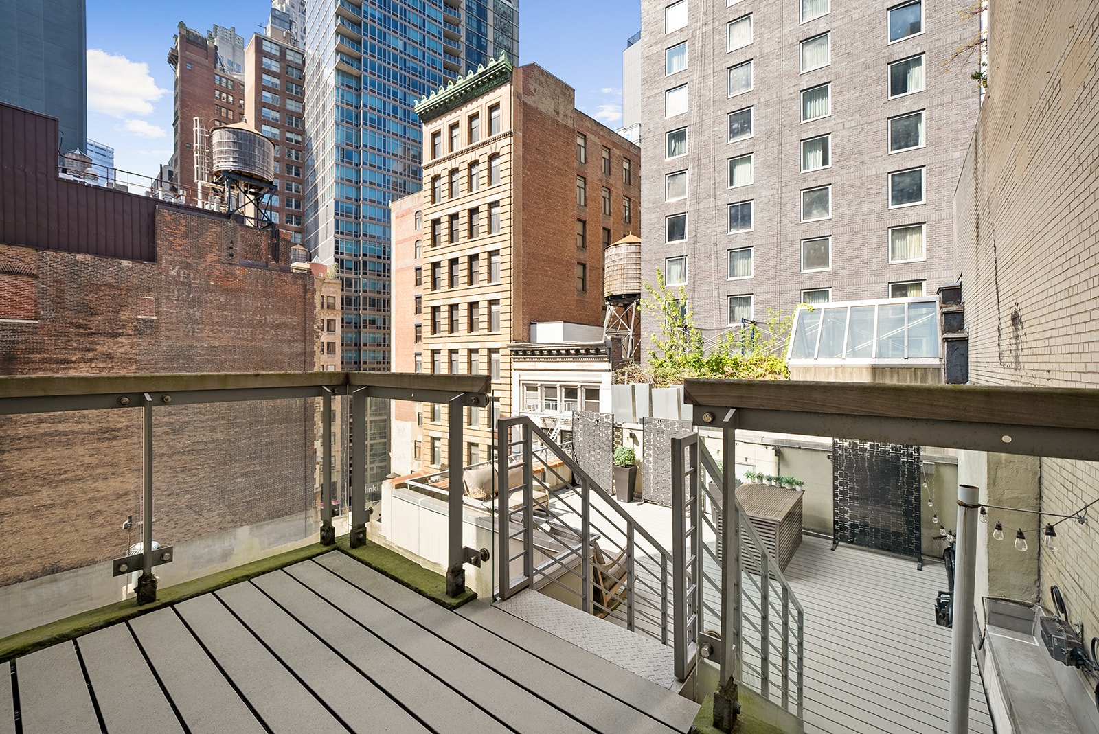 119 Fulton Street, Unit 8 Manhattan, NY 10038 - Photo 10 of 12 a view of balcony with wooden floor