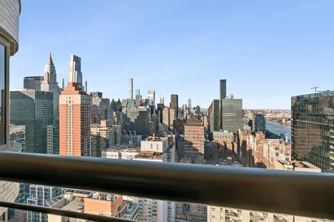 a view of a city from a balcony with city view