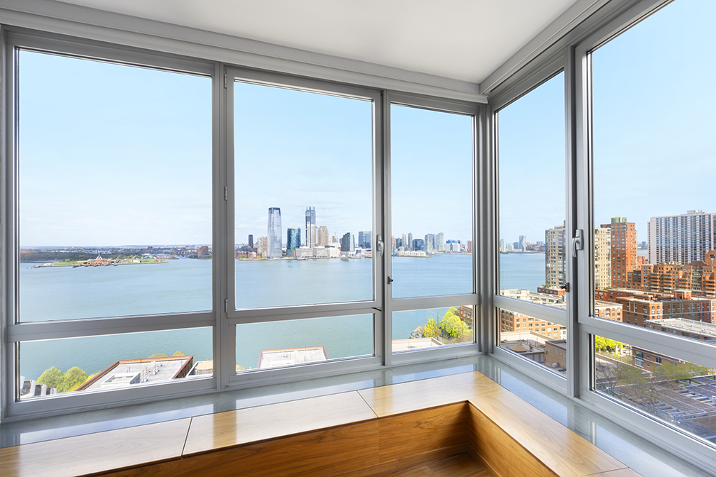 30 West Street, Unit 21AB Manhattan, NY 10004 - Photo 3 of 17 a view of a city from a window