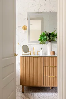 a view of a sink a mirror and window