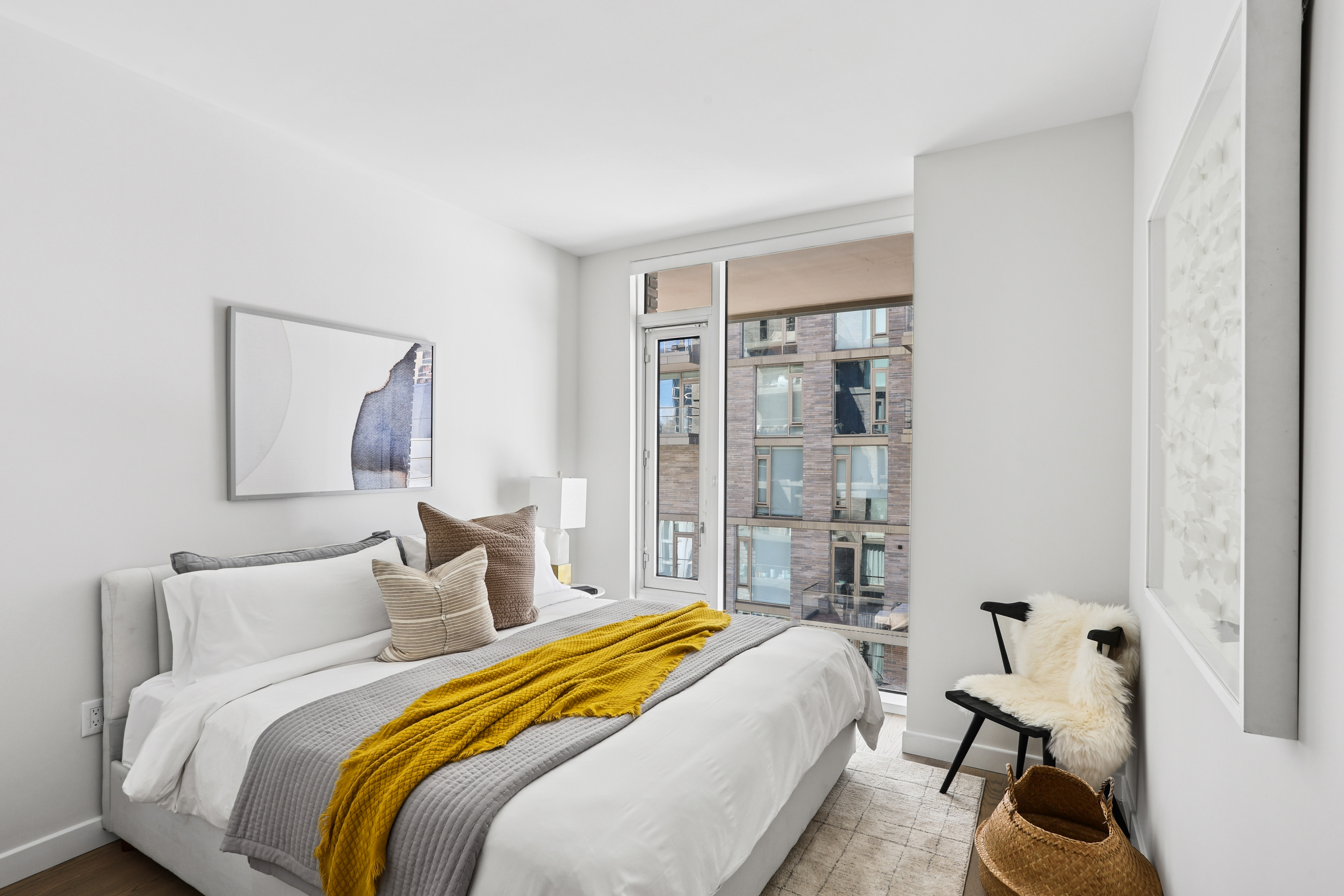 505-513 West 43rd Street, Unit 10B Manhattan, NY 10036 - Photo 9 of 22 a bedroom with a bed and wooden floor