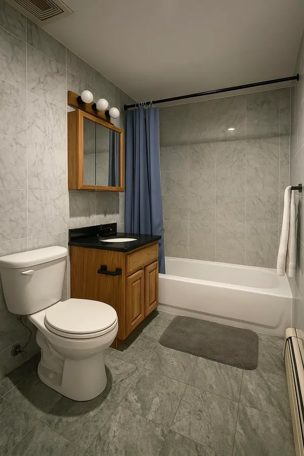 a bathroom with a toilet a sink and a bathtub