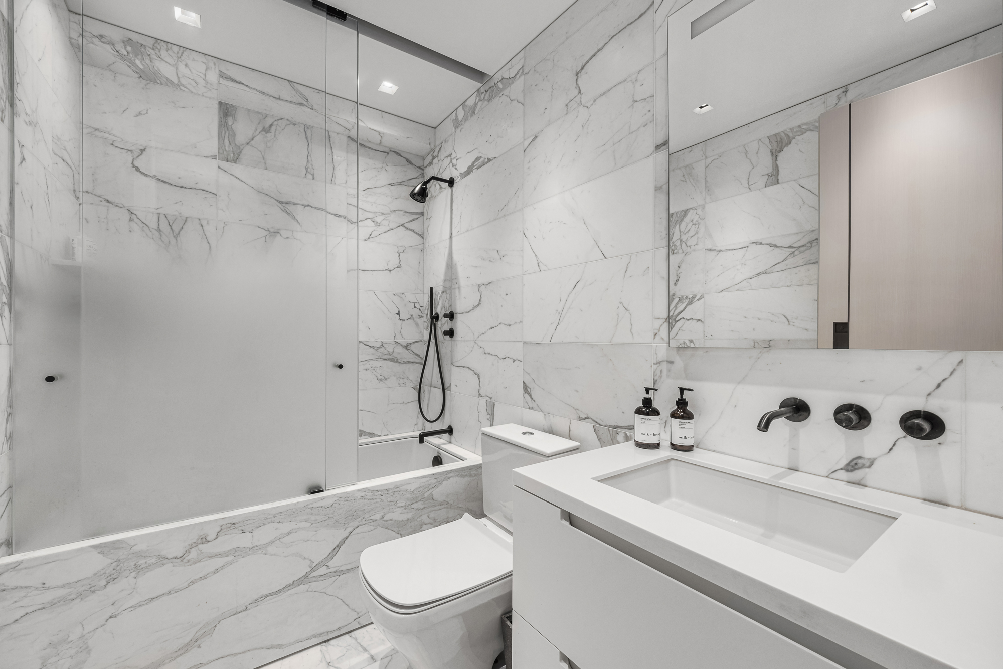 301 West 57th Street, Unit 36C Manhattan, NY 10019 - Photo 23 of 27 a bathroom with a sink toilet and shower