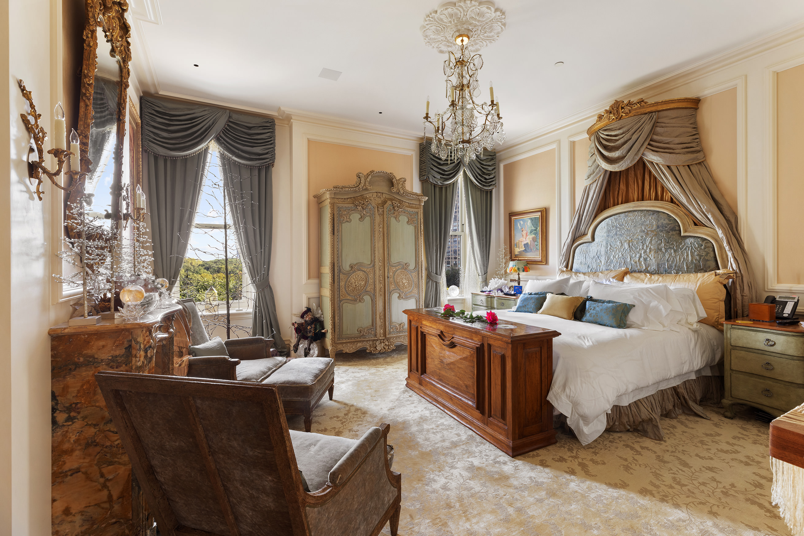 1 Central Park South, Unit 8010203 Manhattan, NY 10019 - Photo 13 of 45 a bed room with a bed and a chandelier